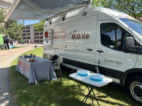 The Public Libraries of Saginaw Bookmobile is set up for an event.